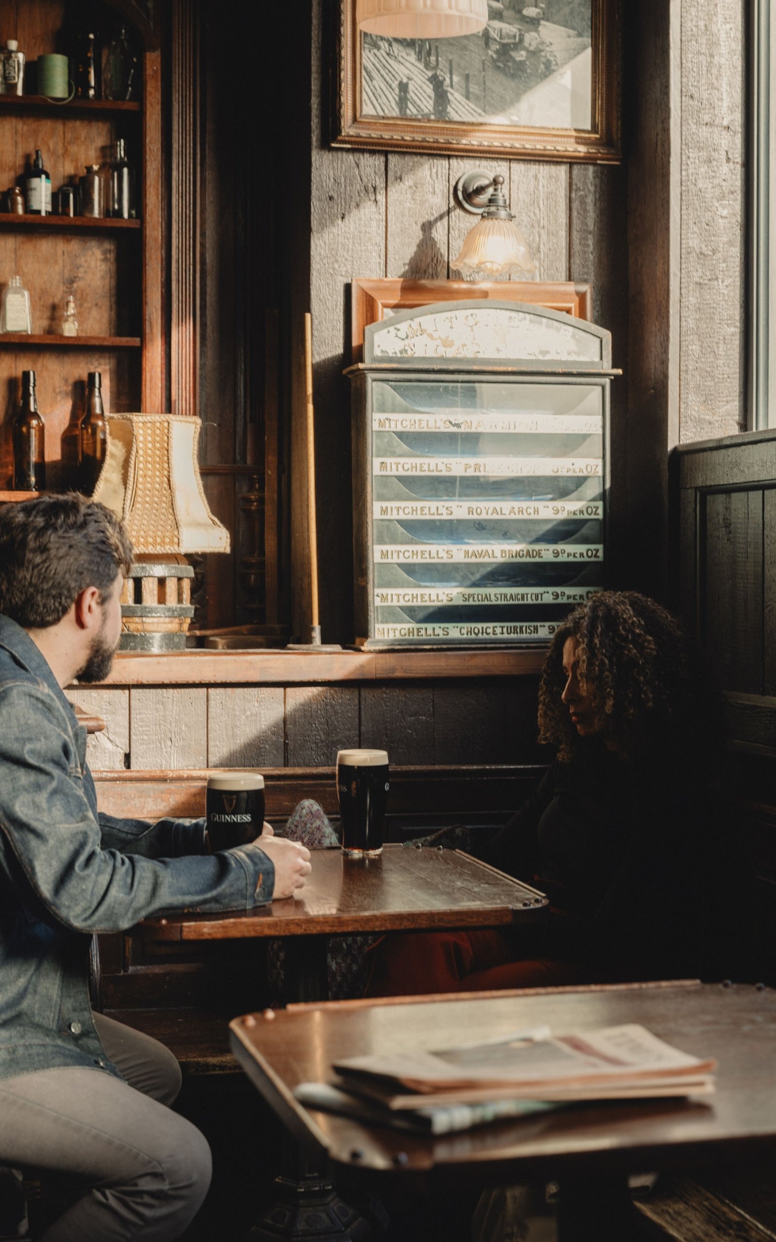 People having a beer inside Tom's tackle Irish Pub.