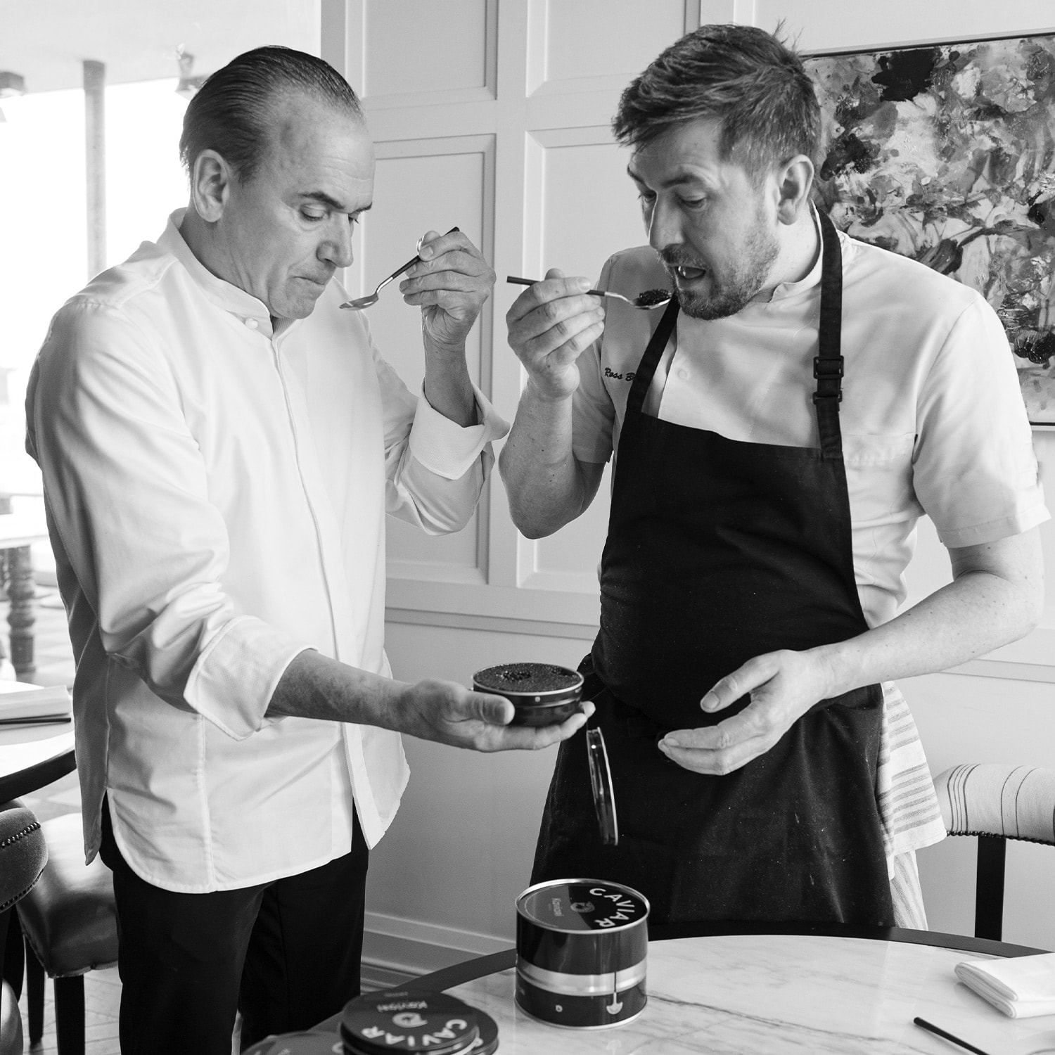 Jean George tasting caviar with a friend