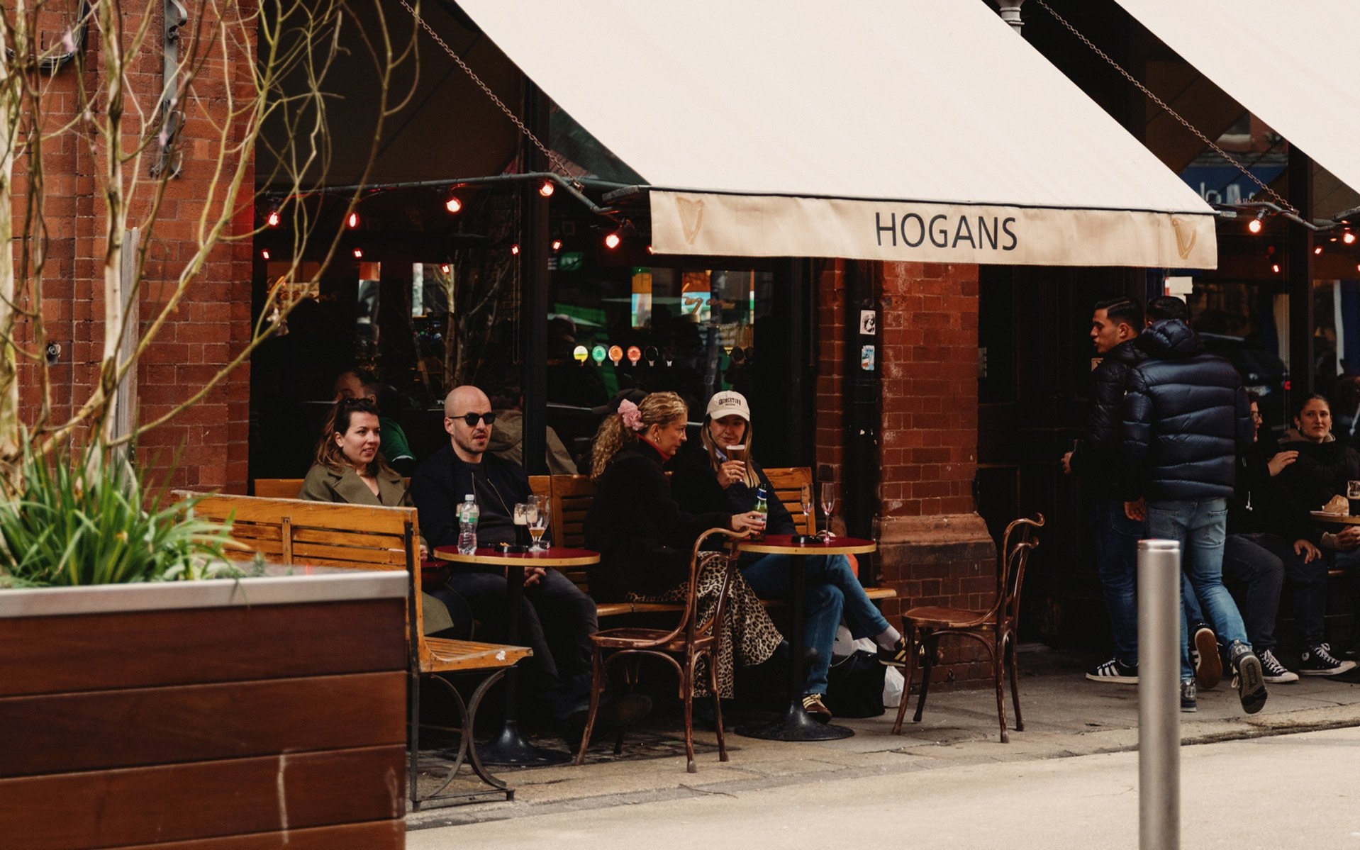 Customers enjoying beverages at an outdoor venue