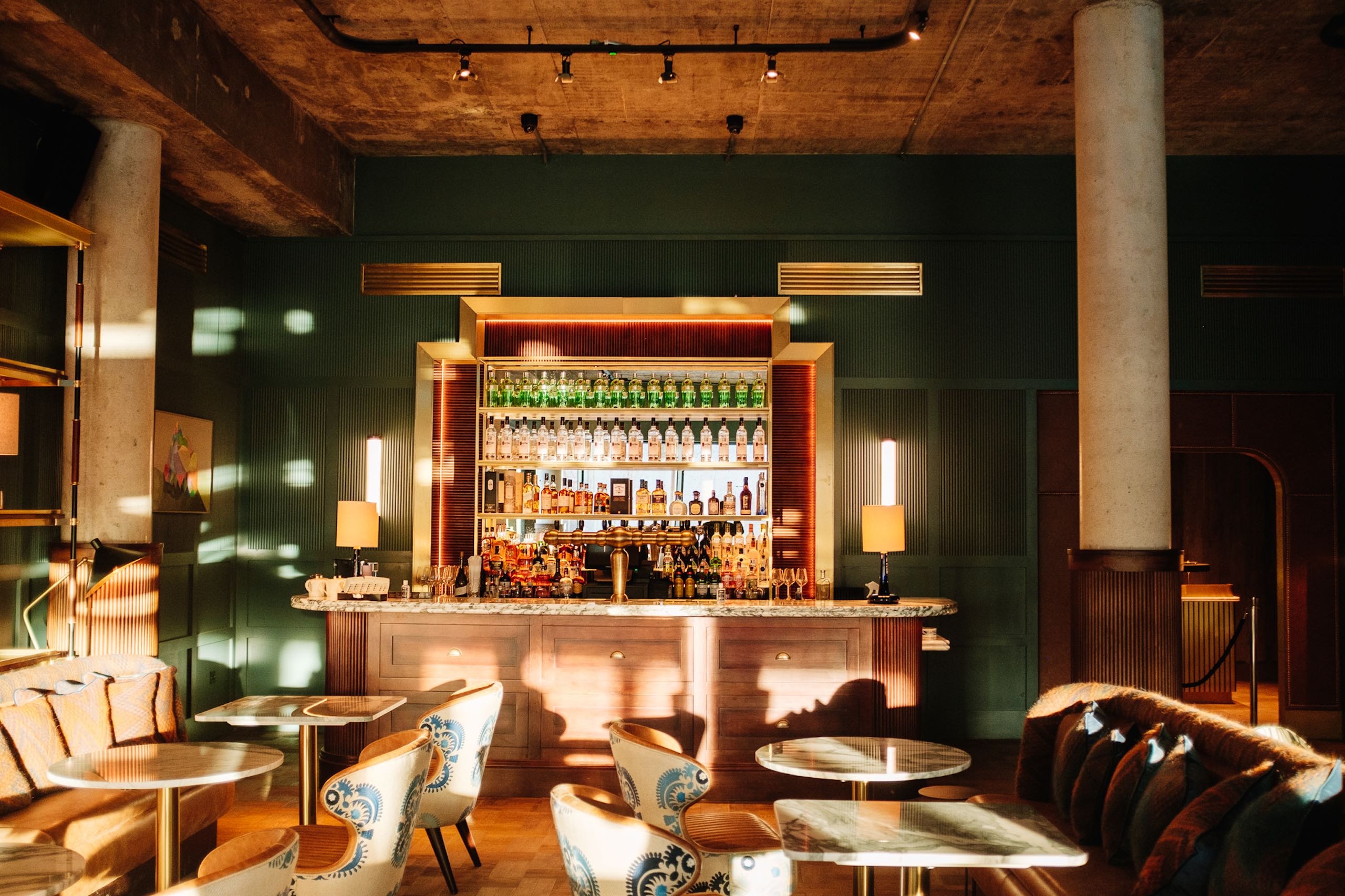 The Dean Bar with green walls and concrete pillars