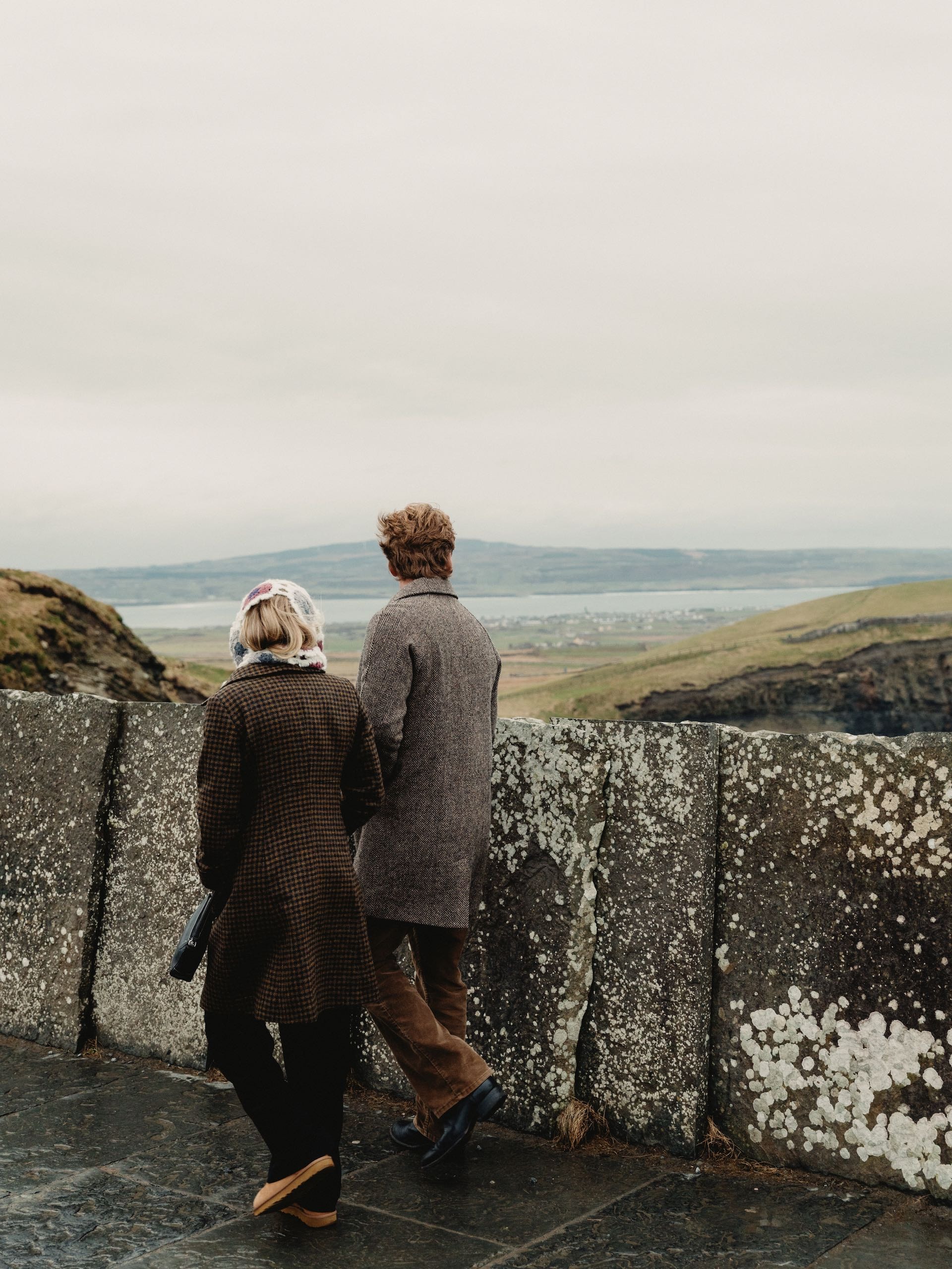A couple walking on a path with beautiful views