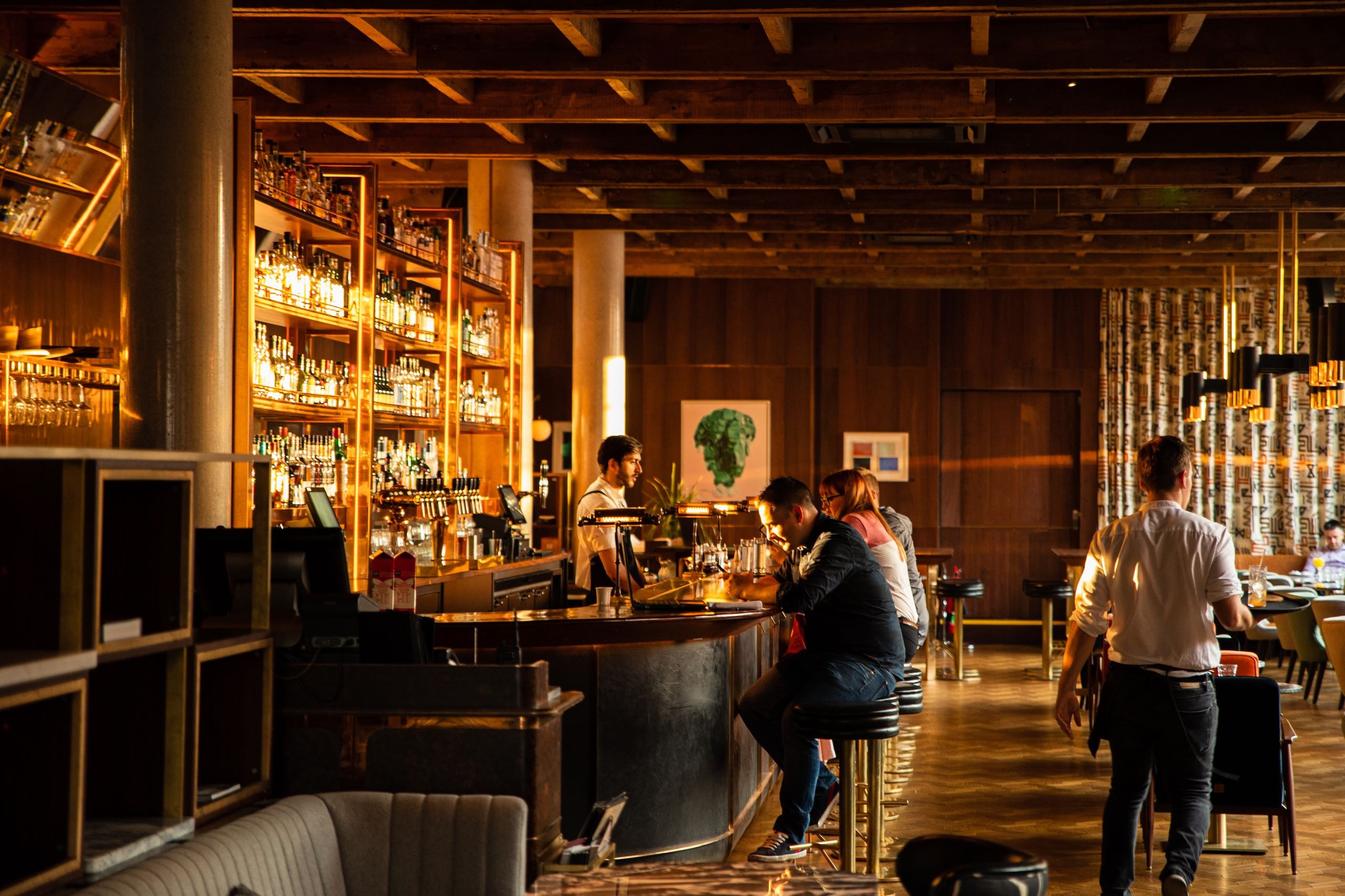 People sitting at the bar in Americana Bar