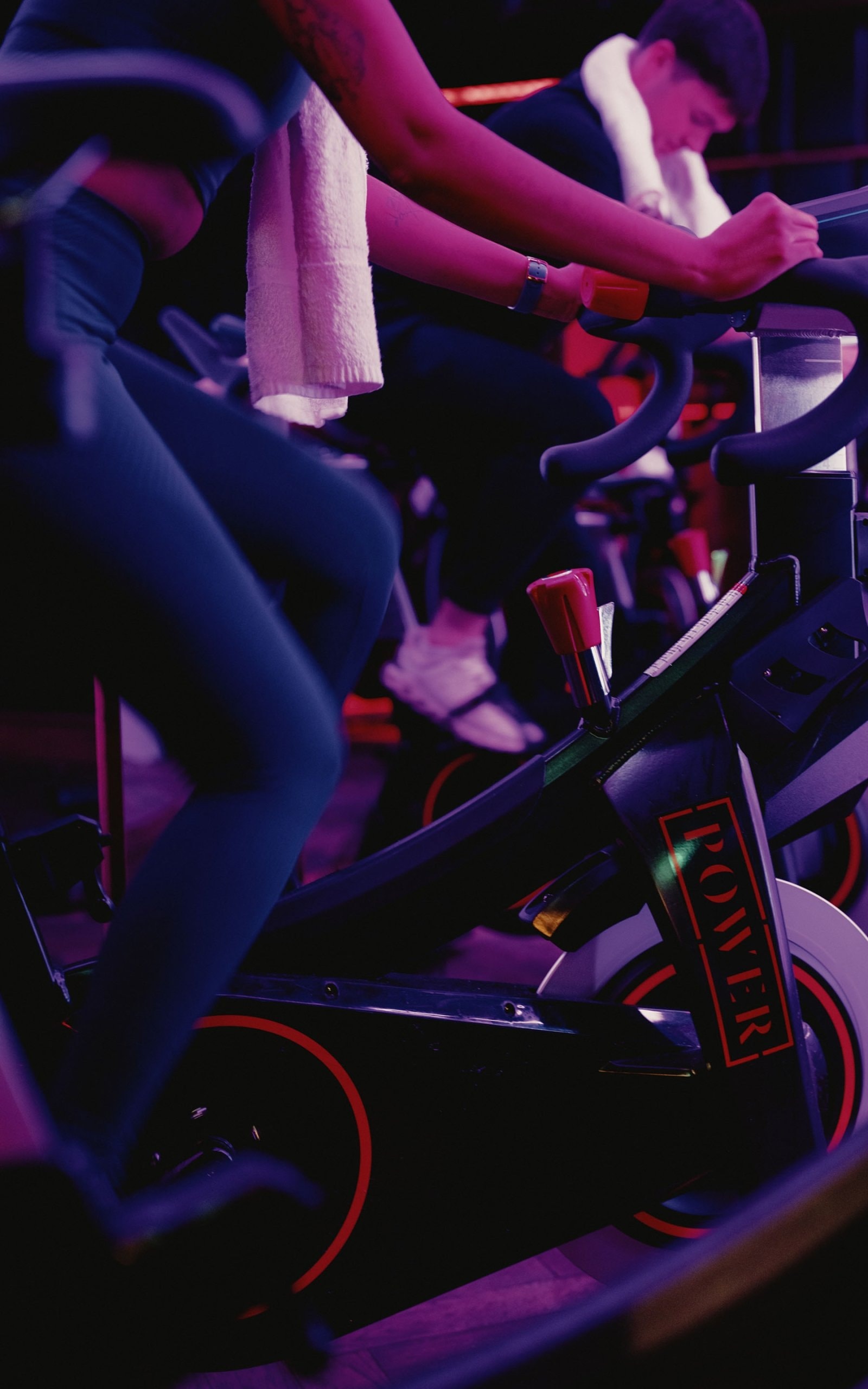 People riding spin bikes