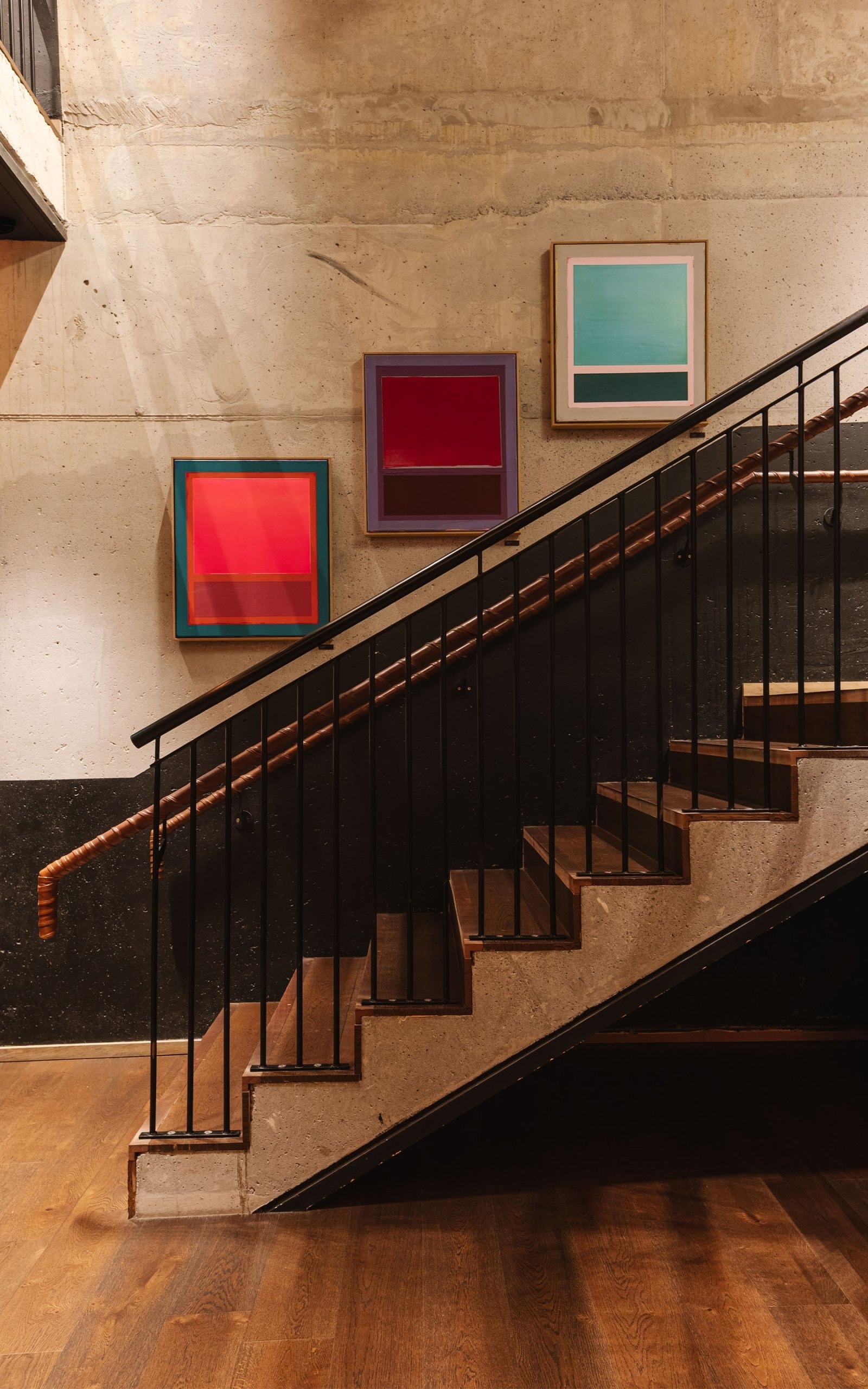 Staircase with art on the wall