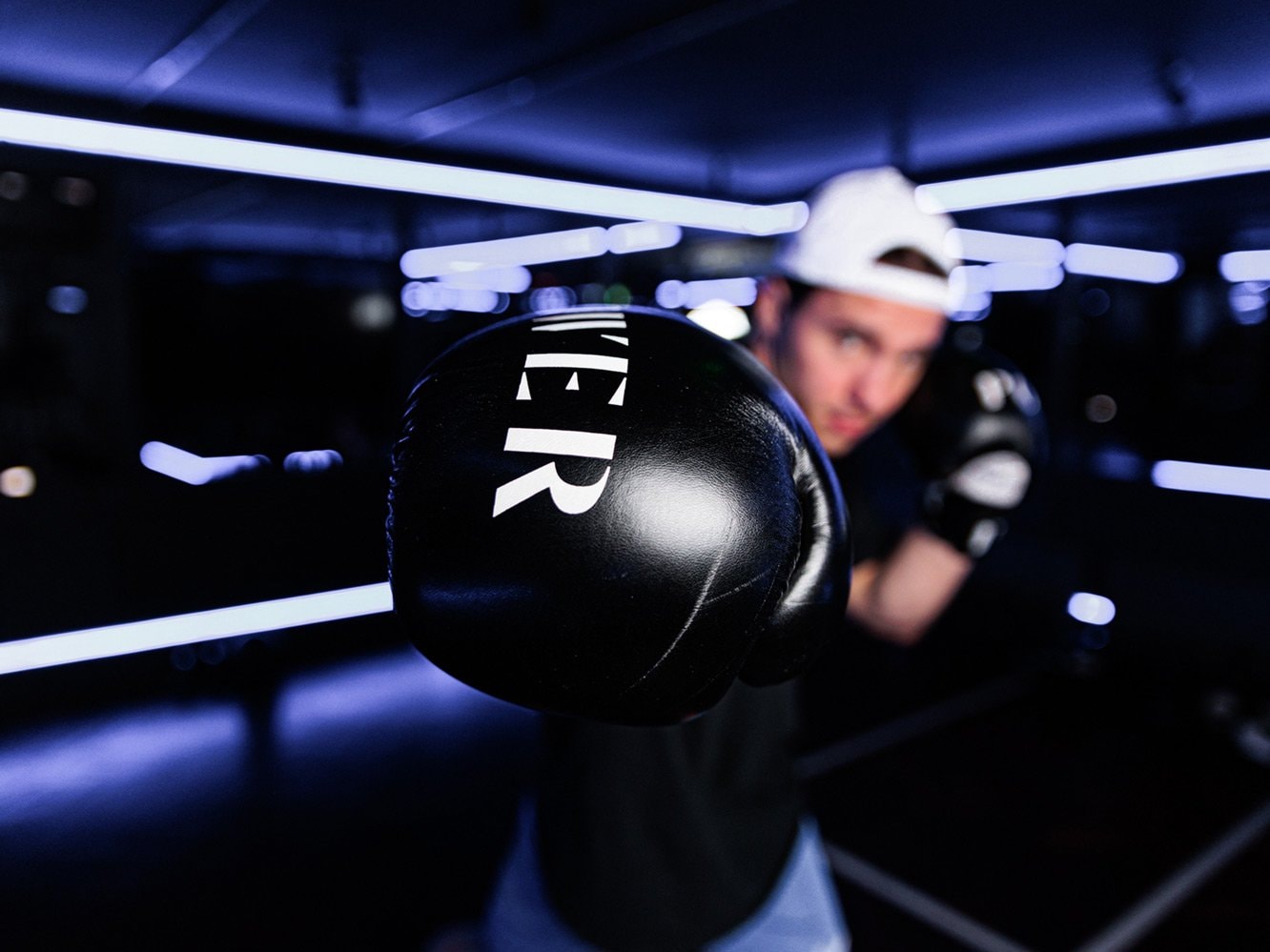 A boxer practicing at POWER Gym, part of the Dean Hotels.
