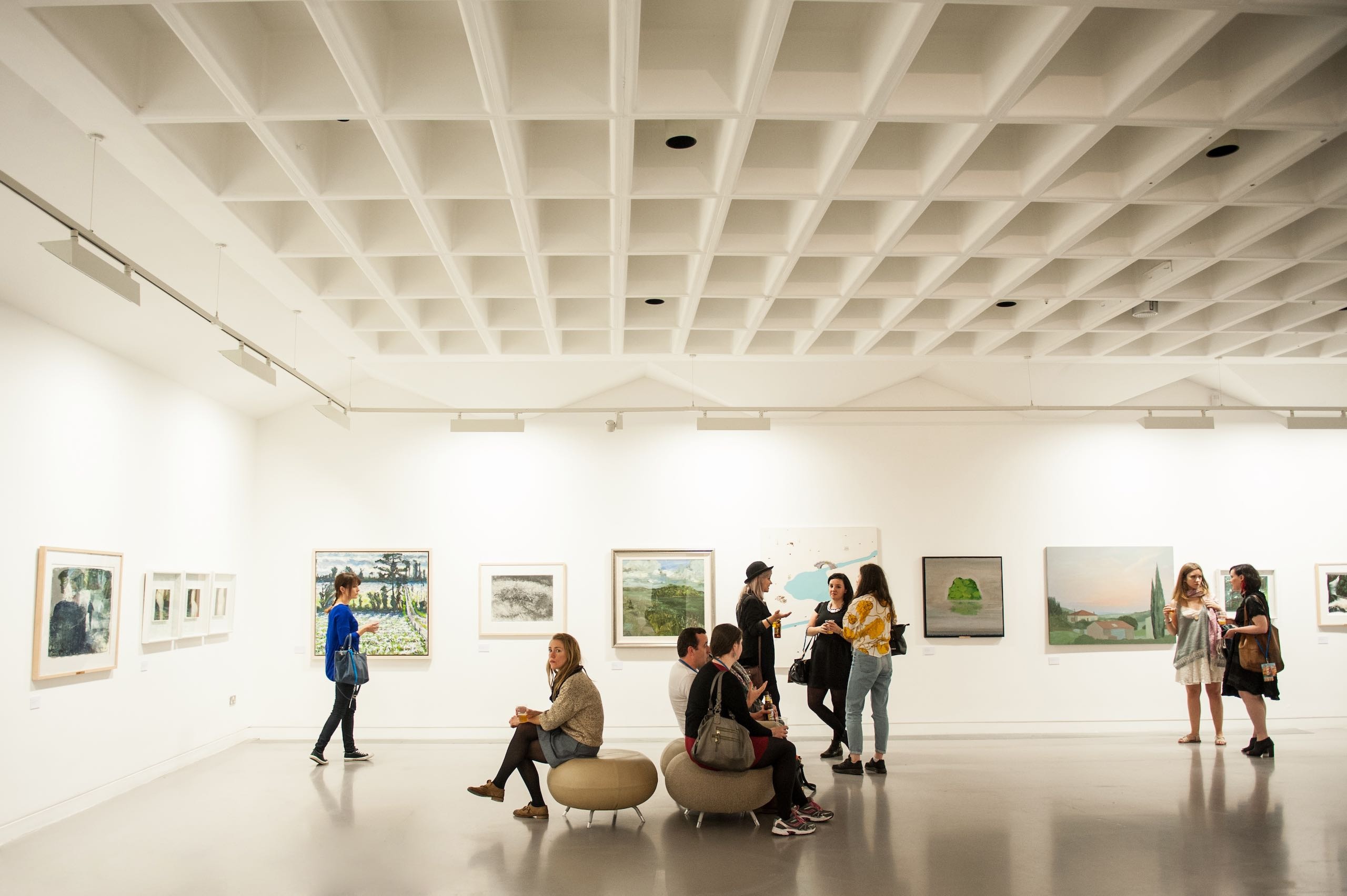 People view art in a Gallery